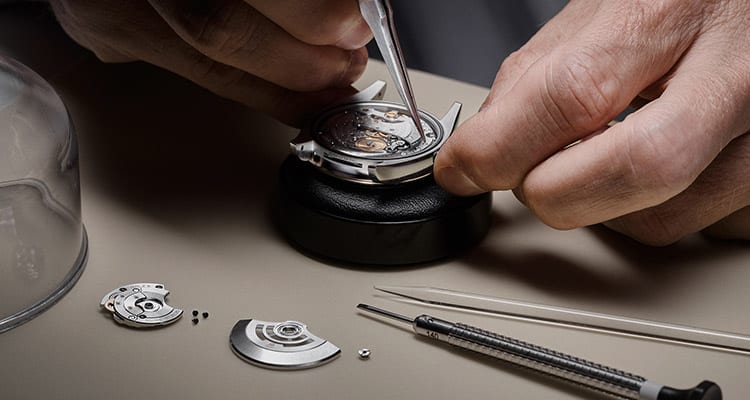 Rolex watch being dismantled