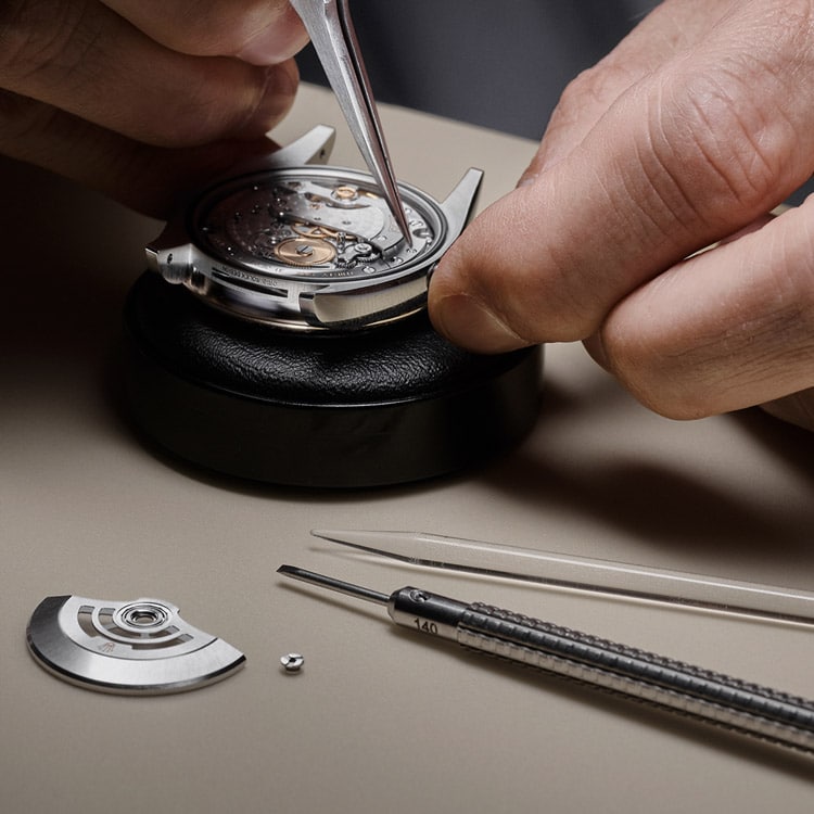 Rolex watch being dismantled